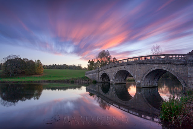 River Glyme at Blenheim Park reflect the sunset colours and the moving clouds by Martyn Ferry Photography