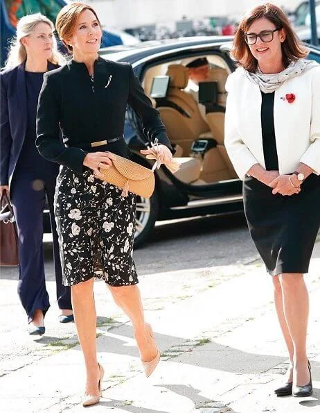 Crown Princess Mary wore a black and white floral dress from Ralph Lauren, and a structured mock-neck blazer from Max Mara. Naledi Gianvito Rossi