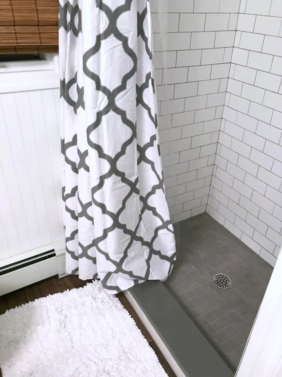 shower curtain with white subway tiled shower