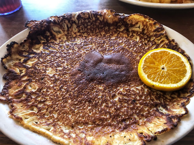 German potato pancake - served with honey and an orange slice