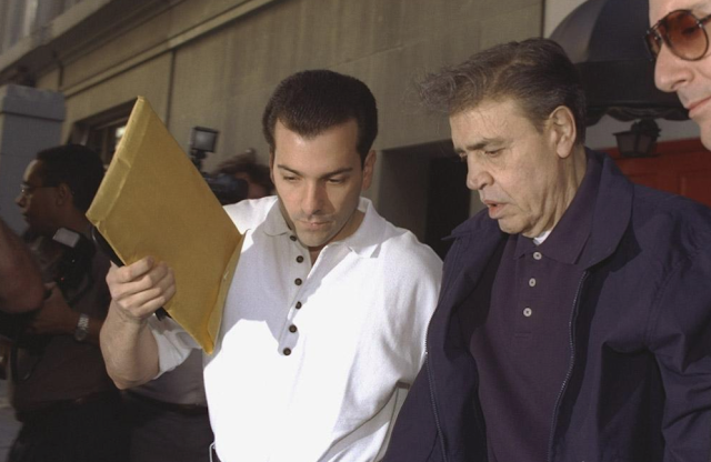 Vincent Esposito walks his father, Vincent Gigante, outside Manhattan townhouse