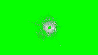 A buillet hole surrounded by cracked glass on a green background