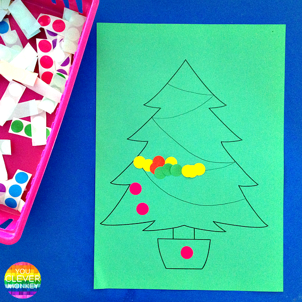 How to Use Christmas to Encourage Writing - why mark making is important to writing development along with 20 different ideas to encourage mark making at Christmas time to help young children develop their writing skills | you clever monkey