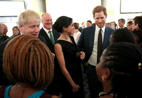 Meghan Markle Wore Black Halo Jackie Belted Dress and Gucci clutch and Aquazurra ankle-strap heels. Prince Harry, Foreign Secretary Boris Johnson
