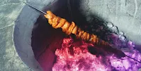 Roasting chicken pieces in charcoal Tandoor for butter chicken Murgh makhani recipe