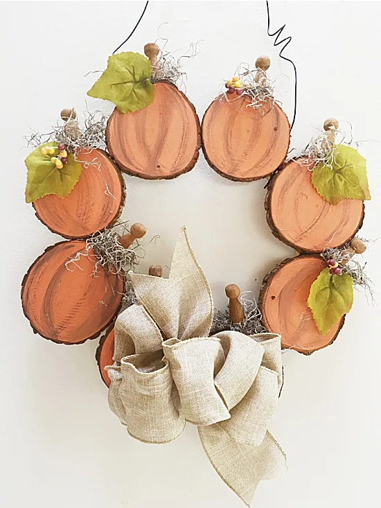 Fall wreath with pumpkins and a bow