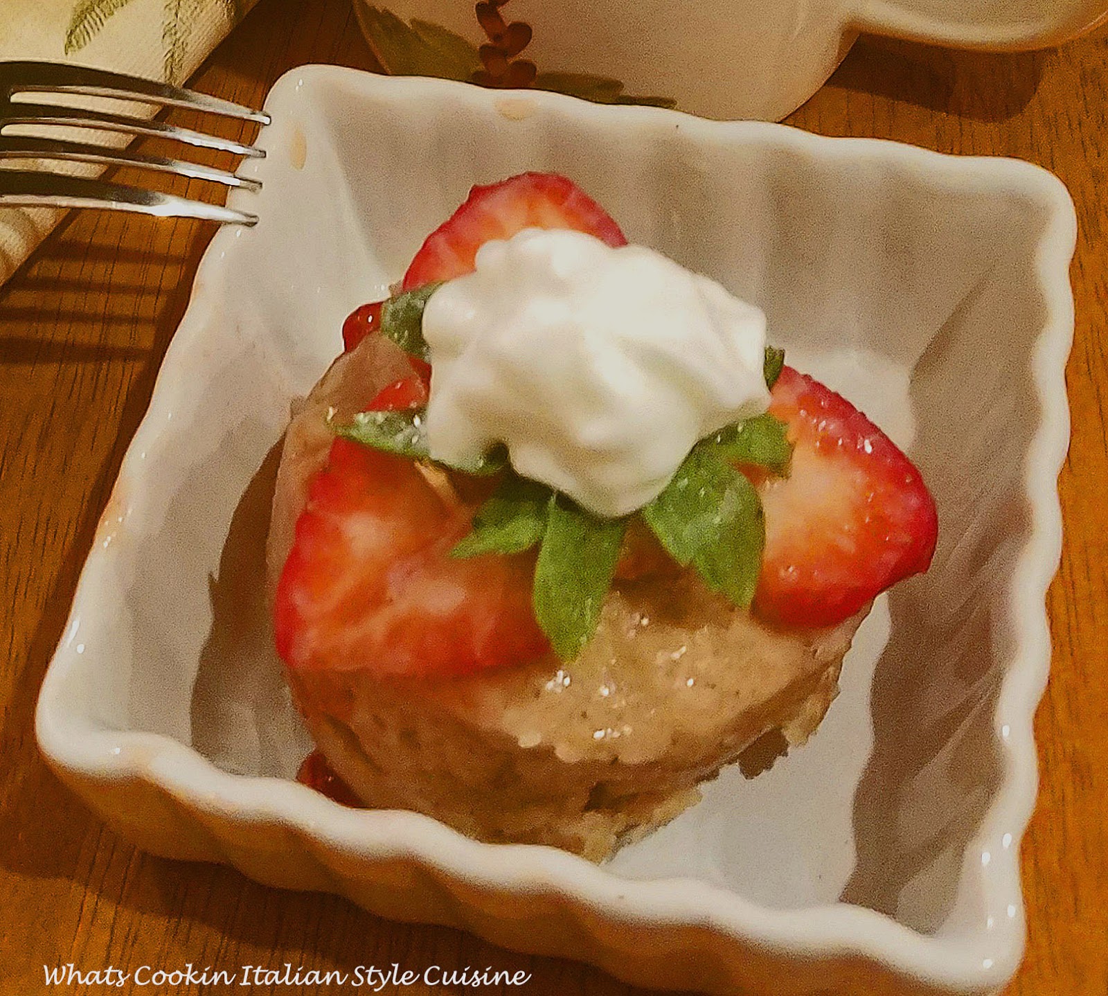 Applesauce mug cake stays moist and with strawberries on top makes it the best shortcake in minutes