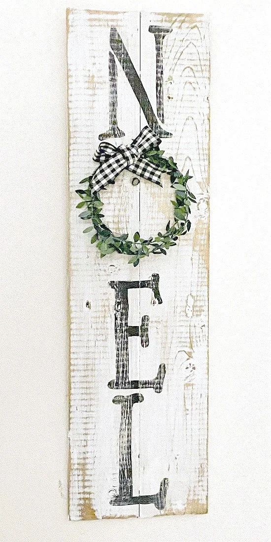 Rustic distressed NOEL sign with wreath for the O