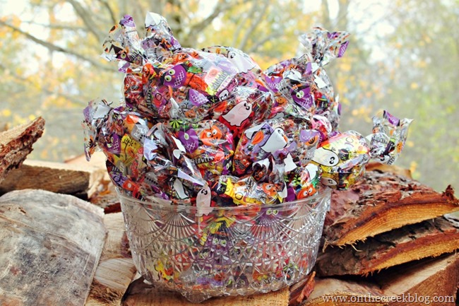 Last-minute Halloween setup featuring treat bags and a repurposed punch bowl as a candy bowl. | on the creek blog // www.onthecreekblog.com