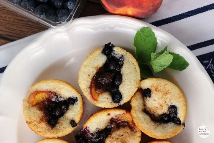 Blueberry-Peach Cobbler Muffins | by Renee's Kitchen Adventures - easy dessert recipe using fresh blueberries and peaches with a light cobbler muffin base.  Perfect for dessert or snack anytime of the day! #RKArecipes #Peach #Blueberries