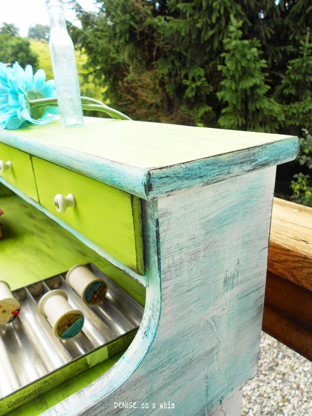 Dry-brushed teal blue over white on a dry sink makeover from Denise On a Whim