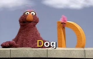 A muppet D and Telly presents the letter D and D words. Sesame Street All Star Alphabet