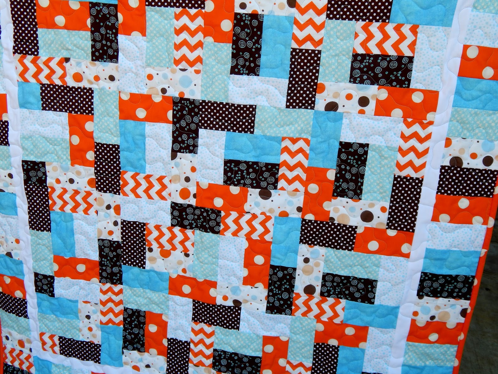 The Fleming's Nine Orange and Blue Baby Quilt
