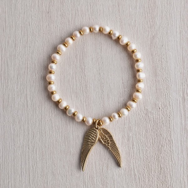 http://www.whitetrufflestudio.com/collections/bracelets/products/white-truffle-gilded-wing-pearl-bracelet