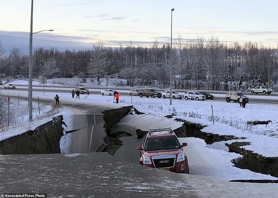 The power of Alaska's earthquake Dramatic aerial images show devastated roads cracked by the