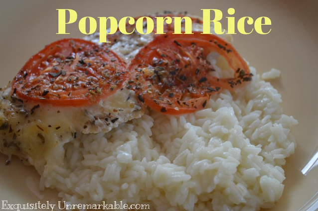 Popcorn Rice text over a plate of chicken and rice