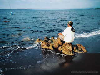 Peaple Fishing On Chunk Of Beach Rocks Of Seabed Rocky Beach Coast At Umeanyar Village North Bali Indonesia