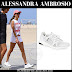 Alessandra Ambrosio in white sneakers and white shorts in Santa Monica on August 4