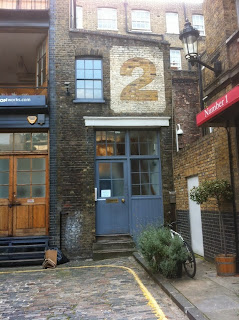 Possible ghost sign in Bleeding Heart Yard, London, EC2