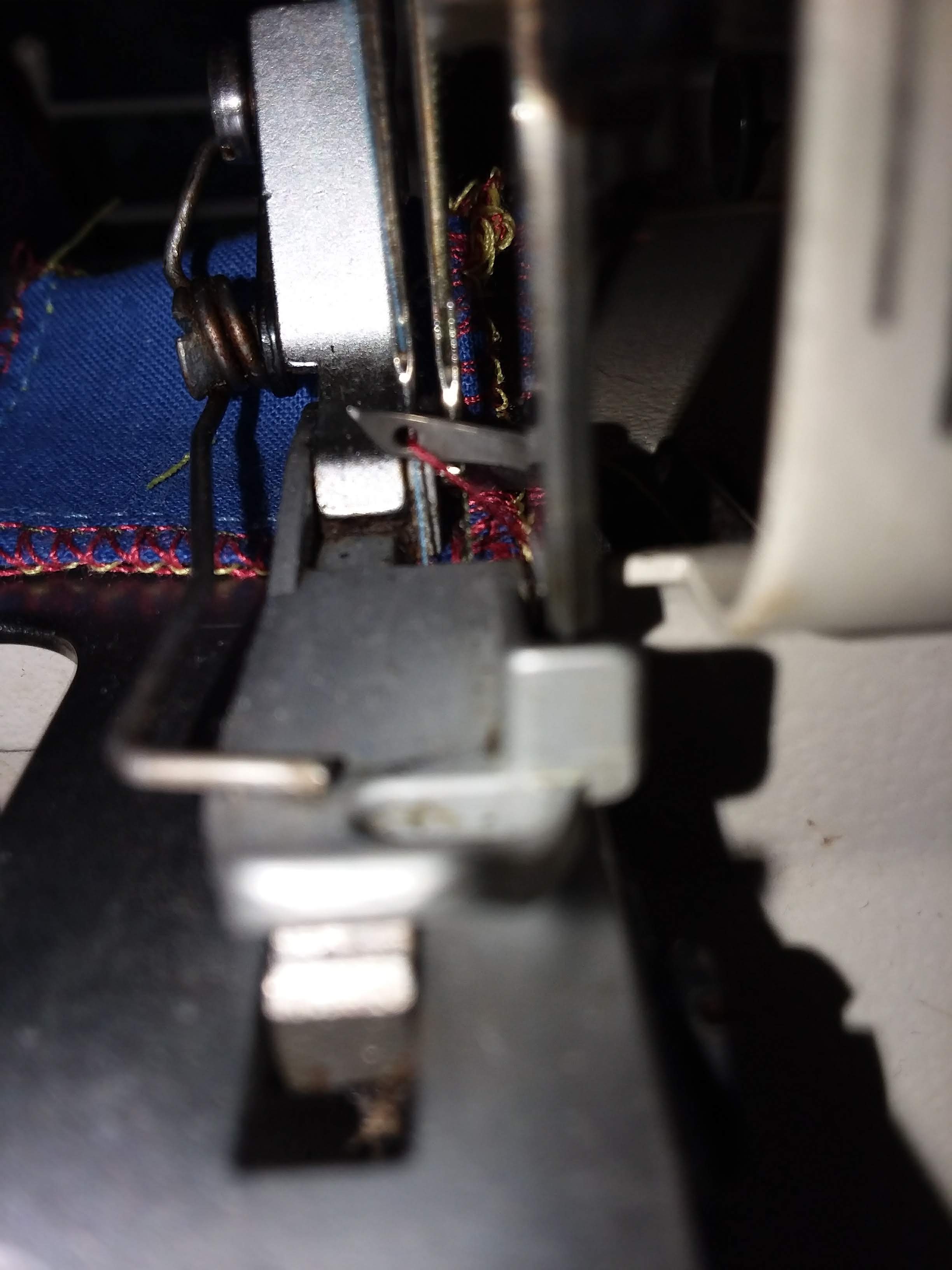 Serger won't catch upper looper thread in left needle