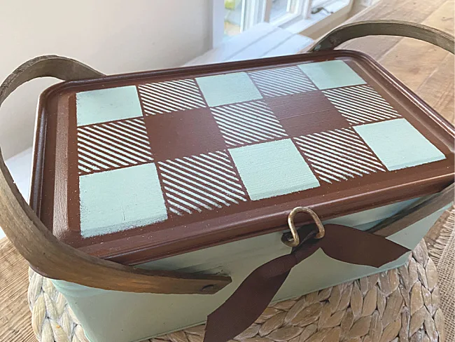 buffalo checked top of vintage metal picnic basket