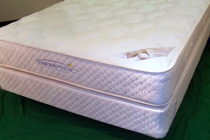 Two Sided Medi-Coil Mattress On An Amish Bed.