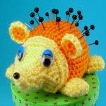 http://www.ravelry.com/patterns/library/hedgehog-pincushion-vessel