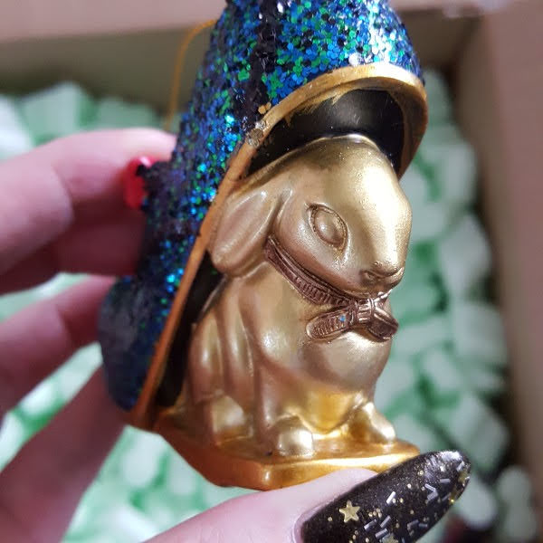 close up of gold bunny shaped heel on Irregular Choice Christmas bauble