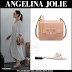 Angelina Jolie in white dress with beige shoulder bag and white buckle sandals in Beverly Hills on August 5