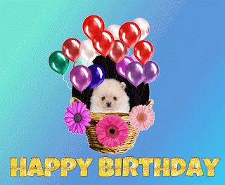happy birthday puupy in a basket
