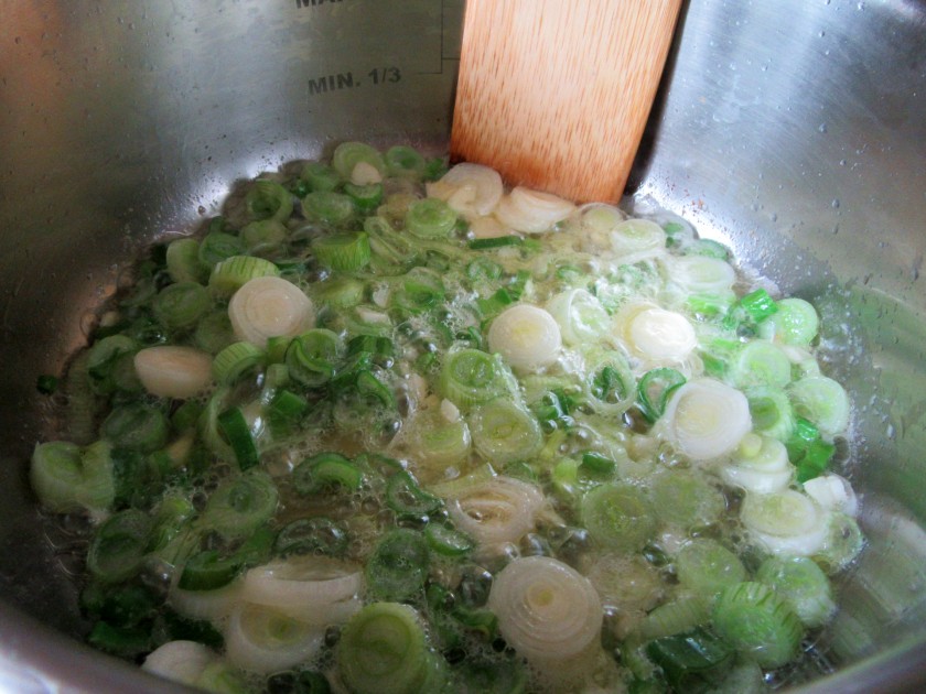 Sauté spring onions and garlic