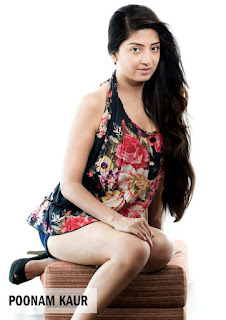poonamkaur sitting pose in black floral short skirt, leg show in high heels