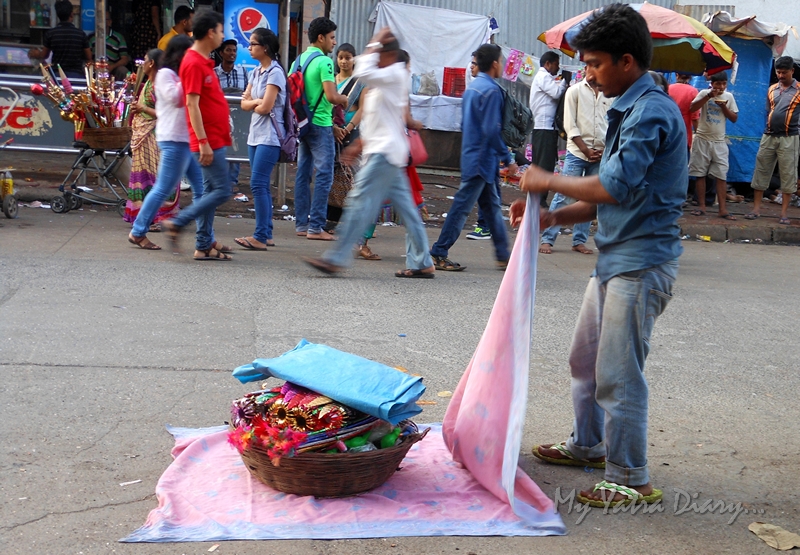 Shopkeeper opening his wares Lalbaugcha raja, Ganesh Pandal Hopping, Mumbai