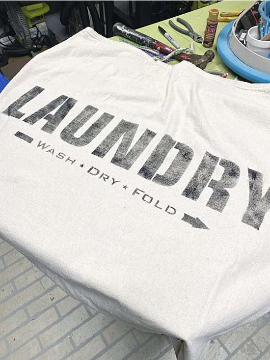 stenciled laundry sign