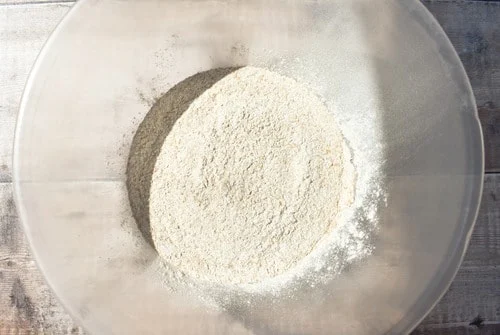 wholemeal self-raising flour in a clear plastic mixing bowl