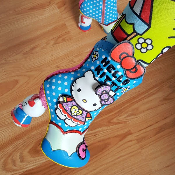 wearing blue polka dot boot with dress up Hello Kitty figure and shaped heel