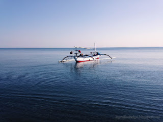 Calm Sea Water Of The Beach And Traditional Fishing Boat Scenery At The Village Banjar North Bali Indonesia