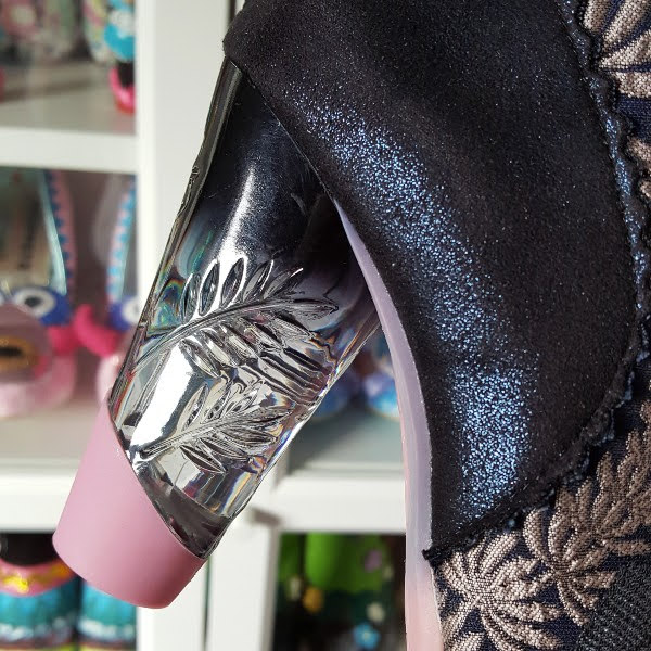 close up of dark graded persepx heel with carved detail and pink tip
