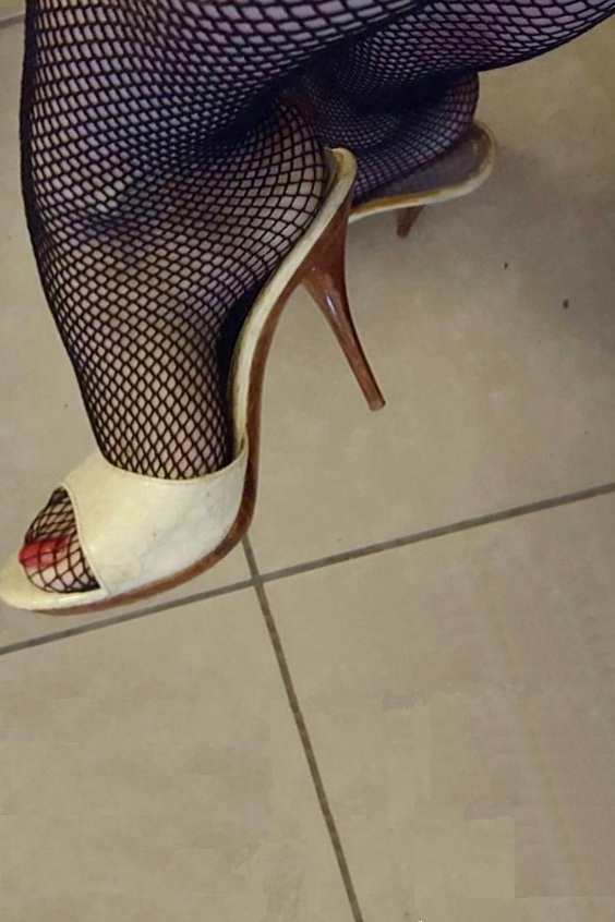 Mules and fishnets are a sexy combination
