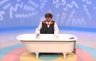 What does Mr. Noodle need to take a bath. He sees a bathtub full of water. Sesame Street Elmo's World Bath Time The Noodle Family