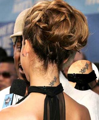 tattoos on back of neck. cross tattoos for women on back of neck