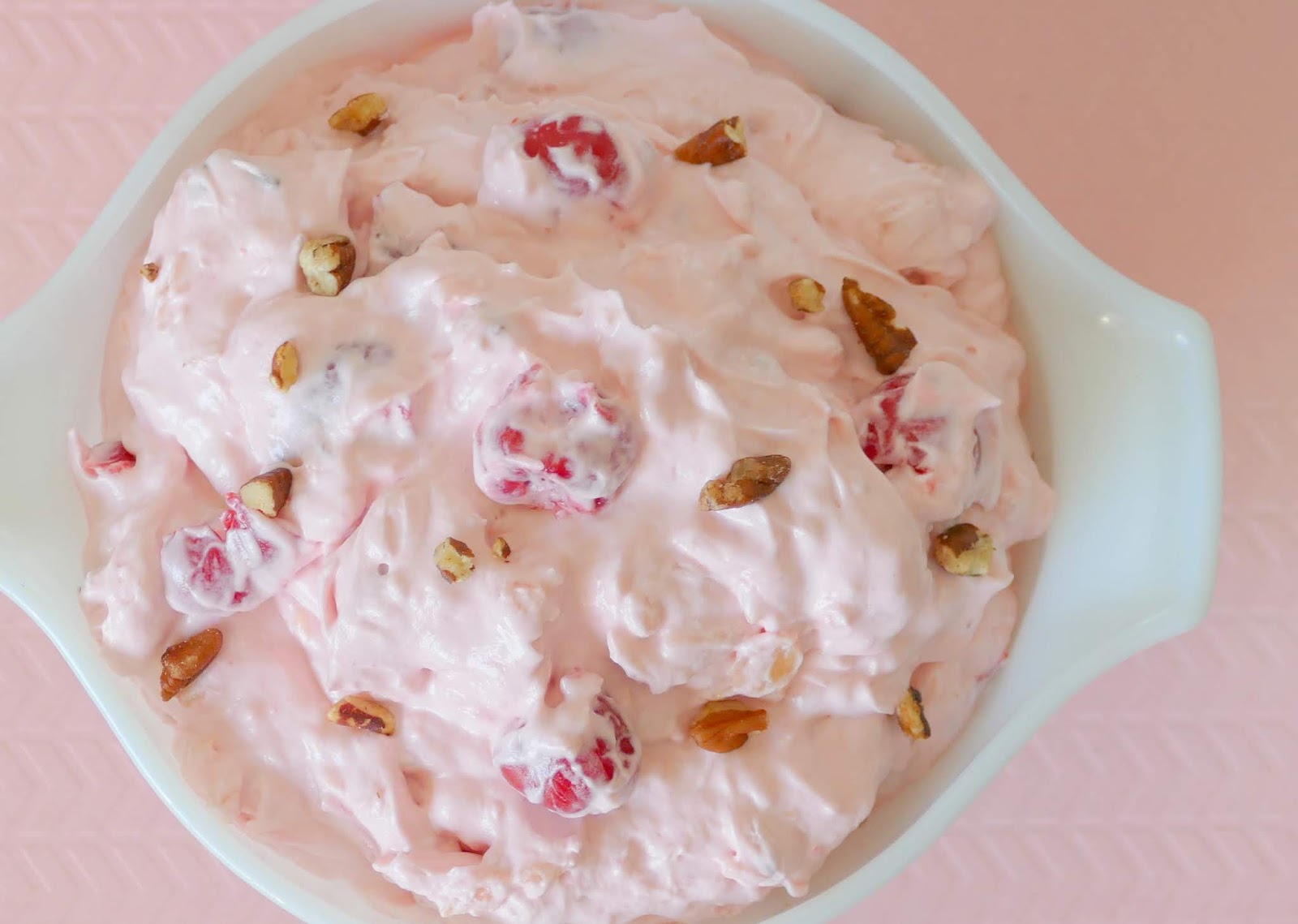 This super easy and delicious dessert fluff salad is great for parties, holidays and potlucks! It will bring you back to your childhood and gets it's flavor from cherry pie filling, crushed pineapple and pecans! Just like Grandma used to make and ready in minutes!