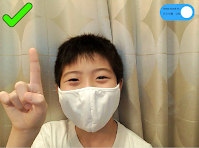 マスク着用している男の子の画像。