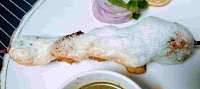 Chicken reshmi kabab with egg serving with green chutney and onion slices