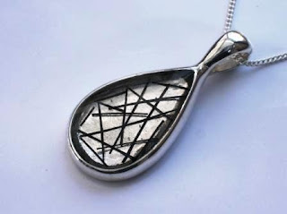 Sterling silver teardrop shaped pendant for hair