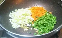 Sauteeing chopped beans, carrot cabbage for hot and sour soup recipe