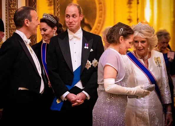 Kate Middleton wore a velvet Alexander McQueen gown, the Lover's Knot tiara, the Nizam of Hyderabad necklace
