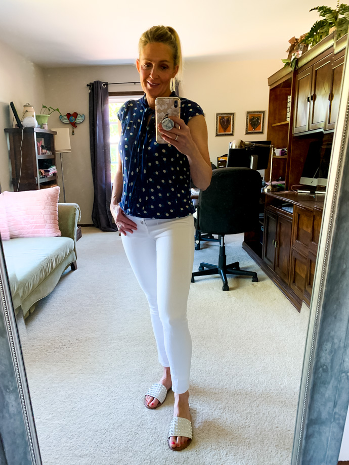 navy polka dot top and white denim