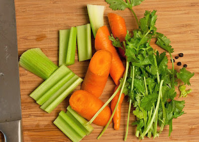 Chopped celery, carrots, parsley, and peppercorns Chopped celery, carrots, parsley, and peppercorns
