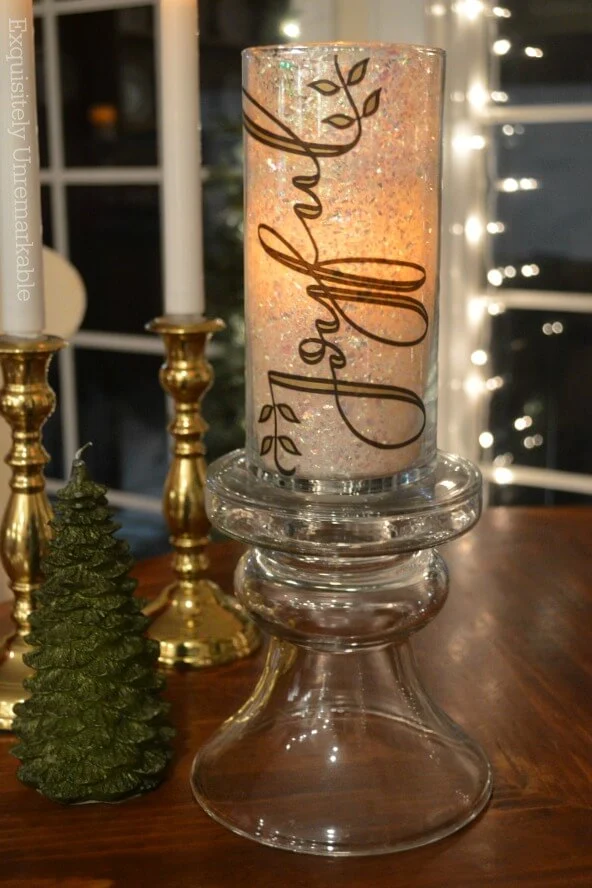 Glitter Candle DIY that says Joyful on table with candles